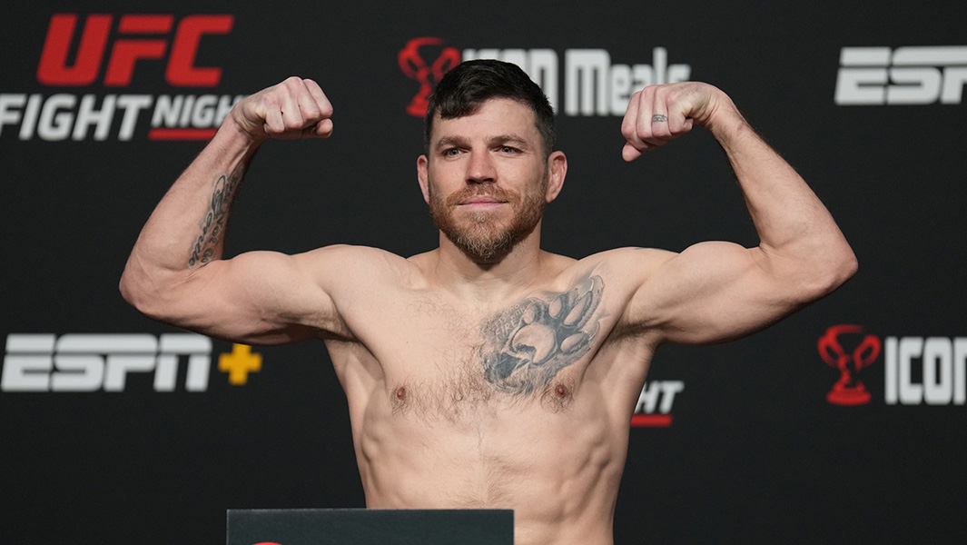 Jim Miller flexing biceps