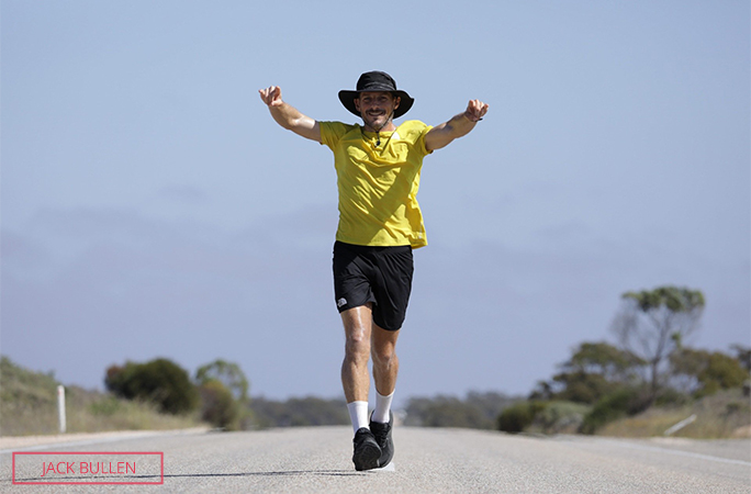 Chris running with his arms up in celebration