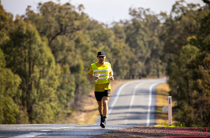 Chris running down the road