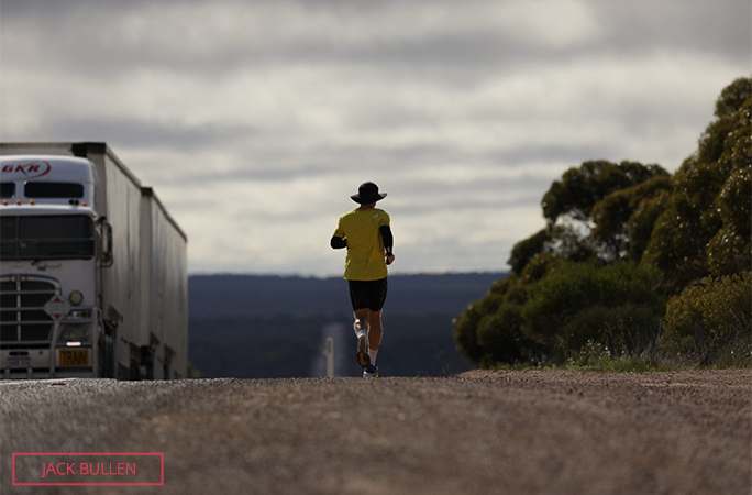 Chris running past a lorry