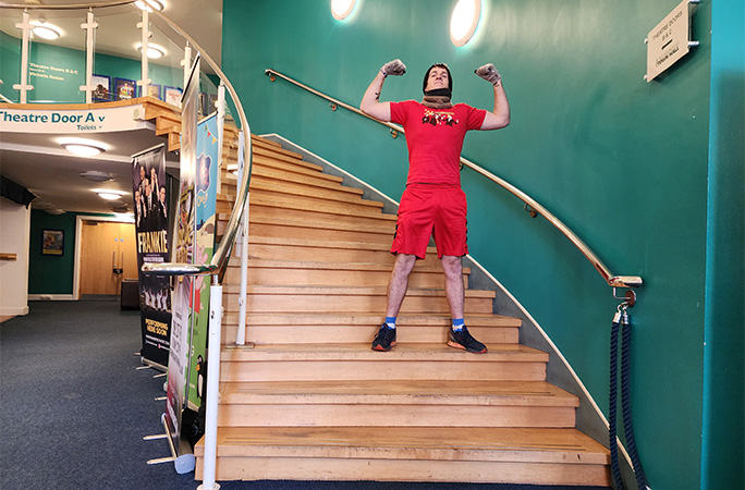 Sean posing on some stairs
