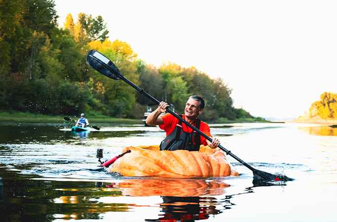 Gary paddling while being followed by someone in a kayak