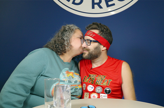 Mike getting a kissfrom his wife Jamie