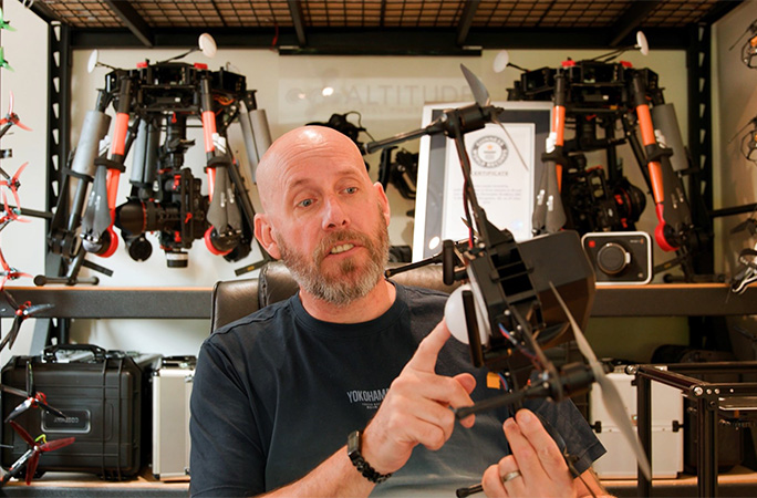 Chris holding a drone