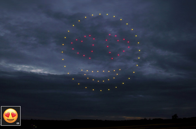 Heart eyes emoji formed by drones