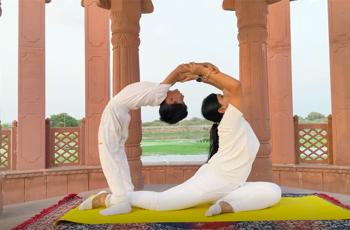 Pratyaksh and his mum doing a yoga pose together