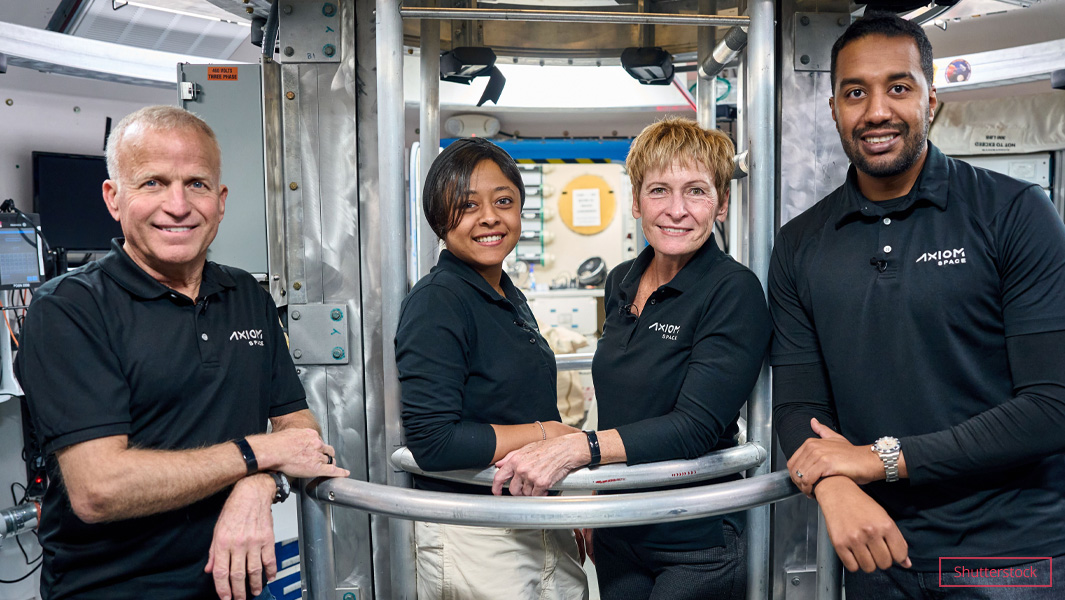 Rayyanah Barnawi with her team inside a spaceship