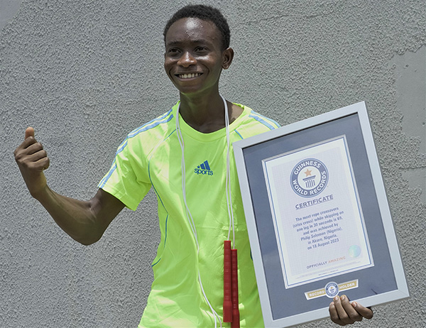 Philip celebrating with certificate