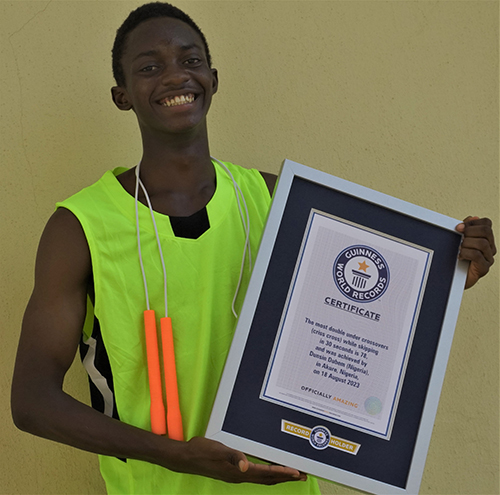 Record holder smiling and showing cert