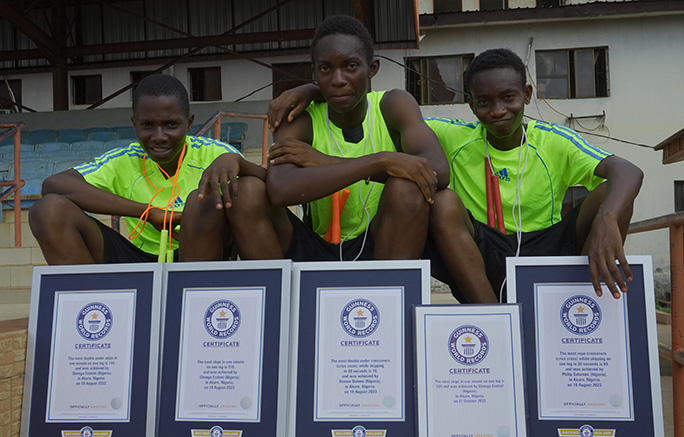 Record holders cheering with certificates