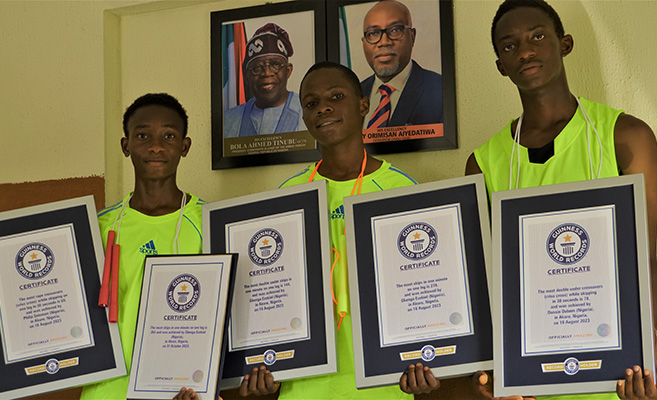 Record holders showcasing certificates