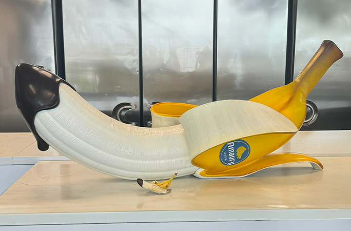 Banana sculpture next to actual banana