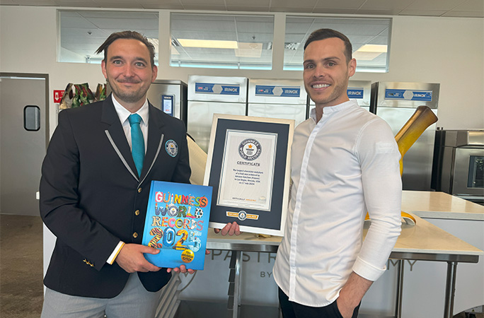 Will Munford presents Chef Amaury with his certificate