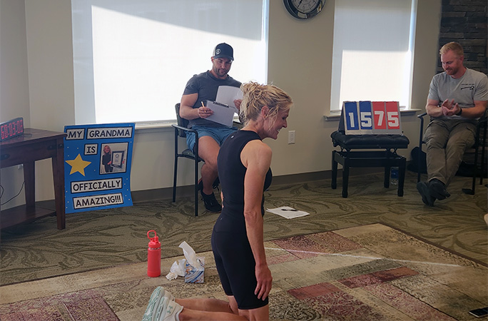 DonnaJean kneeling on the floor