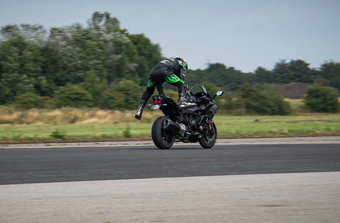Jonny Davies mid jump off the back of his bike
