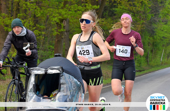 Khrystyna pushing her son while running