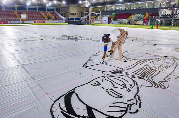 Fola at work on the drawing