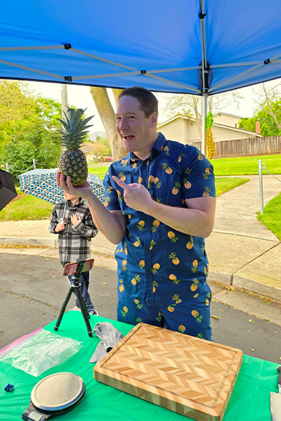 Rich posing with a pineapple