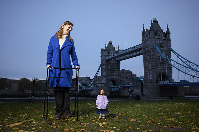 Rumeysa and Jyoti look at each other at Tower Bridge