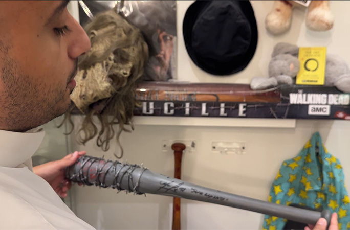 Rashid holding a replica weapon