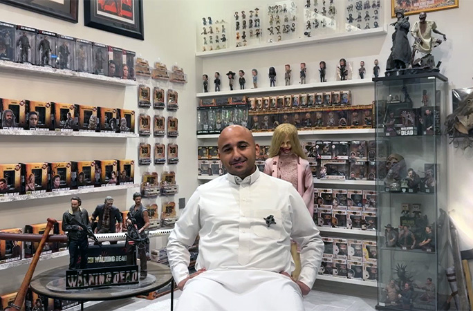 Rashid surrounded by his collection