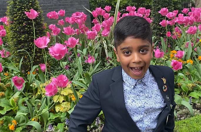 Aneeshwar standing in a garden