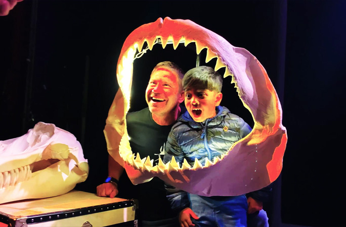 Aneeshwar and Steve in a shark jaw skeleton
