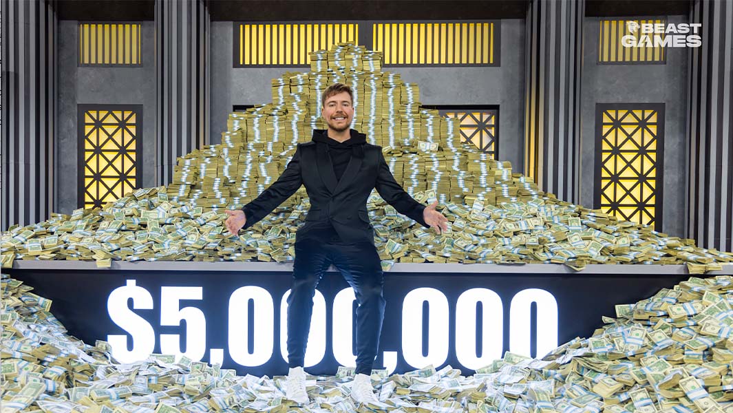MrBeast standing in front of $5,000,000 cash