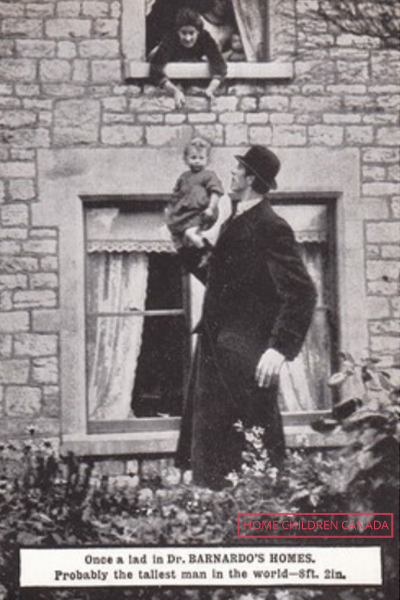 Frederick passing a child to someone in an upstairs window