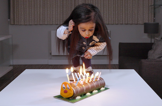 Jyoti blowing out candles on her cake