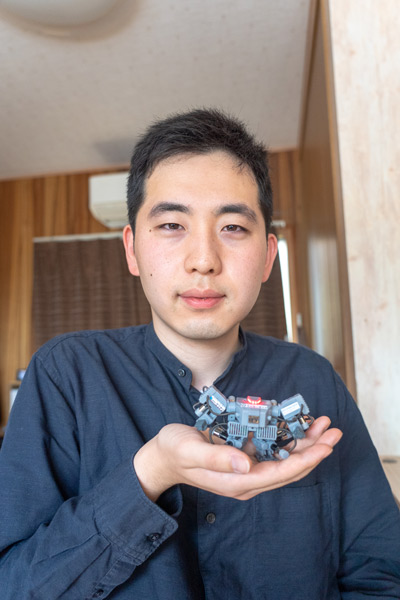 Smallest humanoid robot being held in hand