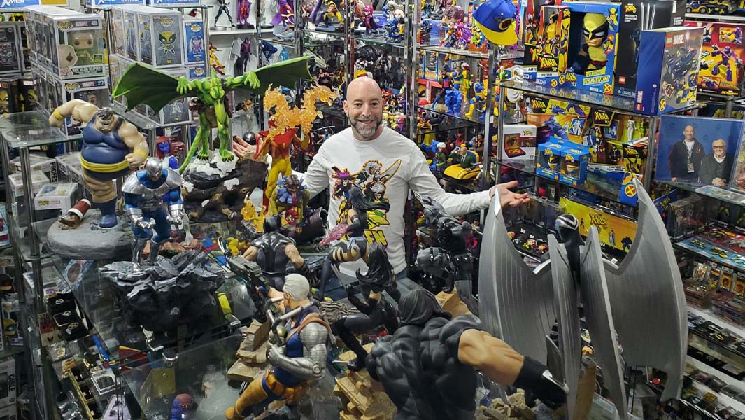Eric Jaskolka standing amongst X men collection