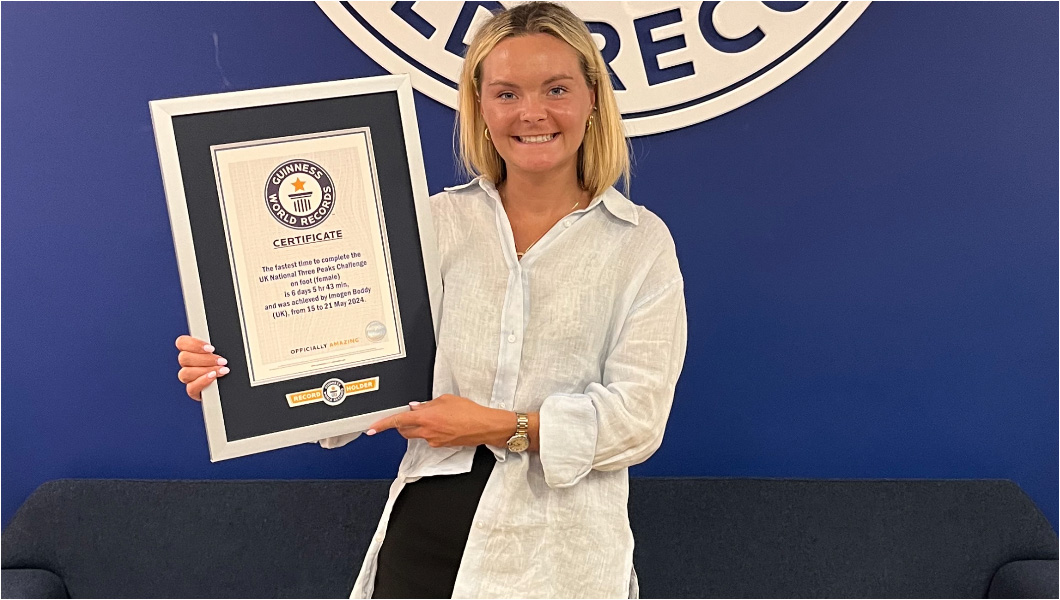 Imogen Boddy holding certificate