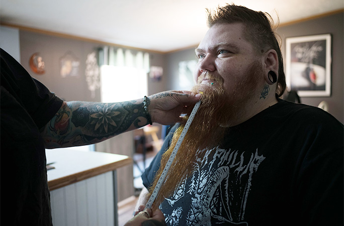 Erin having her beard measured.