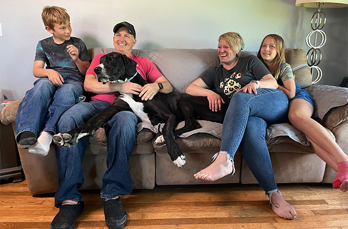 Kevin on the sofa with his family