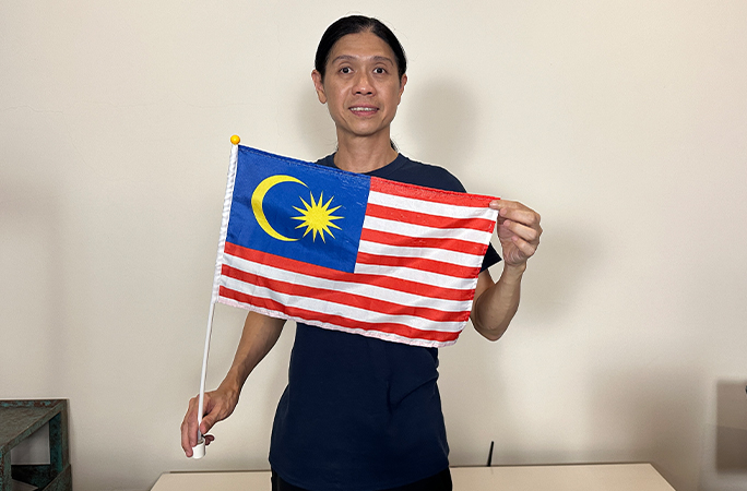 Avery Chin with a Malaysia flag
