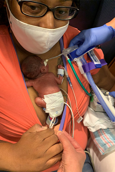 Newborn Curtis on his mom's chest