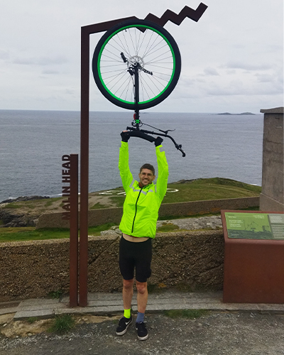 Eamonn raising unicycle in air