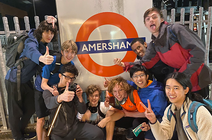 Group of friends in front of Amersham sign
