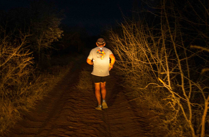 Keith on a dirt road at night