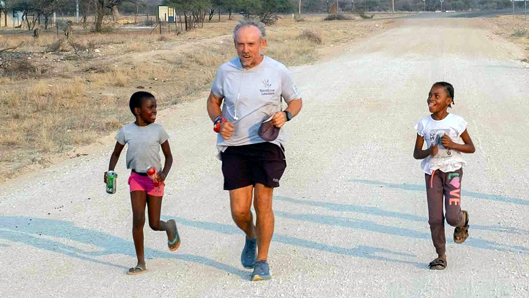Keith running alongside children
