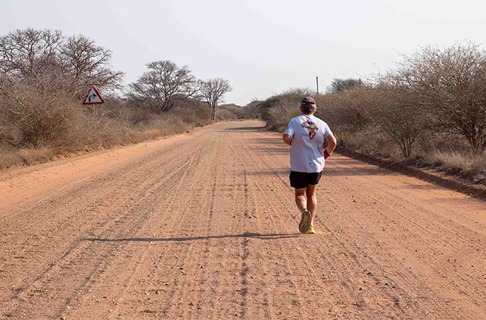 KEith running on a dusty road