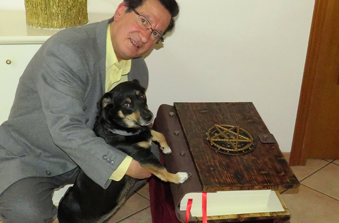 Michele and his dog with the book