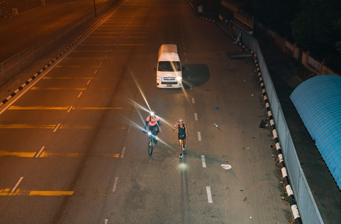 Natalie Dau Running in the dark with a cyclist accompanying