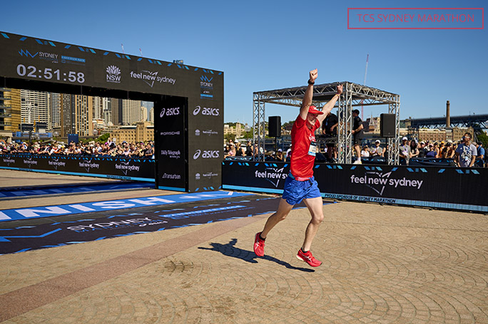 Red shirt runner smiling