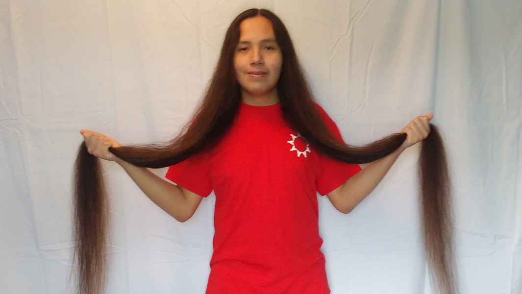Reuben holding his hair in both hands