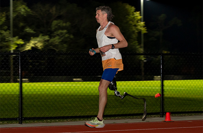 Adam running at night