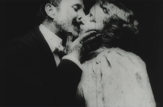 The couple lock lips