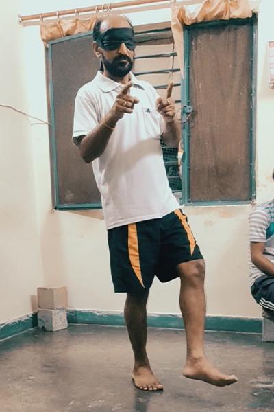 Ram on one leg pointing fingers