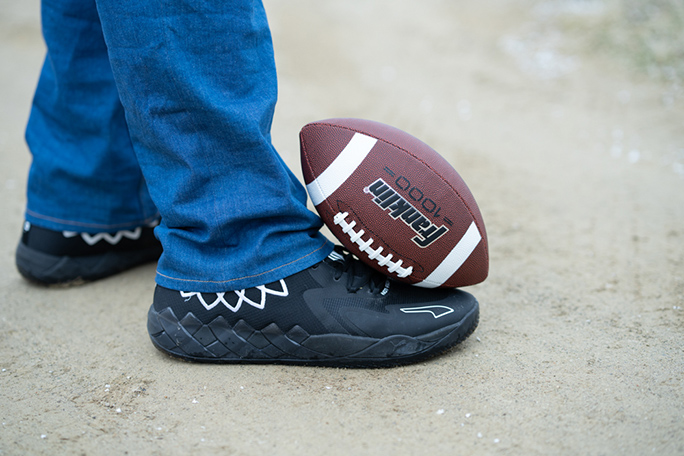 Eric's foot with a football